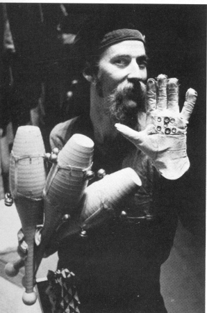 Rhythm in his hands... Tim Furst shows whack-o glove and the jingle-bell shod clubs that add a ring to his beat.