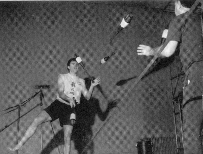 Paul Foster practices club passing from a slack wire (photo by Bill Giduz)