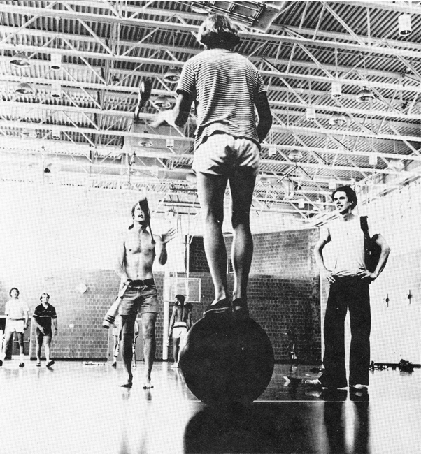 Rodger French of Atlanta. Ga.. feeds clubs to a partner from atop a rolling globe. Once during the convention. he passed clubs from his precarious perch to a circle of /6 people surrounding him!