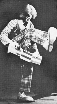 John D. Hadfield performs a cigar box manipulation routine.  (Clown College photo)