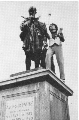From atop his pedestal, Laval's own Ambroise Pare', an early and highly regarded French surgeon, reacts with curiosity to a juggling visitor sharing his pedestal.  