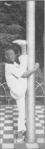 Master Chang stretches before morning exercises.