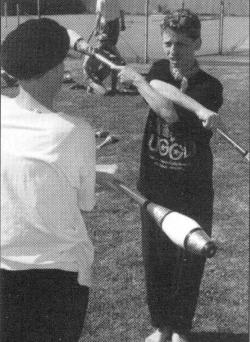 Simon Pipe teaches club swinging to Maya.