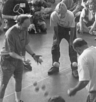 Fran Favorini and Fred Strempl compete in the ball bouncing competition in the gym lobby in Burlington. (Bill Giduz photo) 