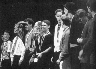Tony Duncan holds the IJA Championships Trophy in the middle of the lineup as Championships winners bow for the crowd in Burlington. (David Carper photo)