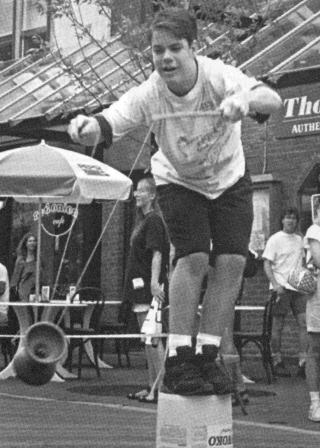 The object in the diabolo accuracy high toss in the games at Burlington was to record the best time aloft without falling off the bucket.  Jason Patz stretches here for a catch, and won the event with a 3 second time.  (Bill Giduz photo)