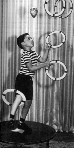 Albert shows an early version of the "garbage" trick at age five. 