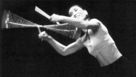 (Above) Atsuko Koga creates art with the devil stick.  (Photo (c) Brad Yazzolino)