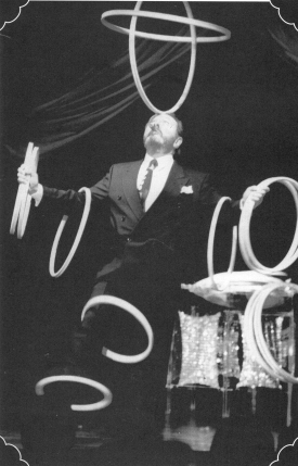 Bramson prepares to spin six hoops on his arms to complete one of his trademark tricks.